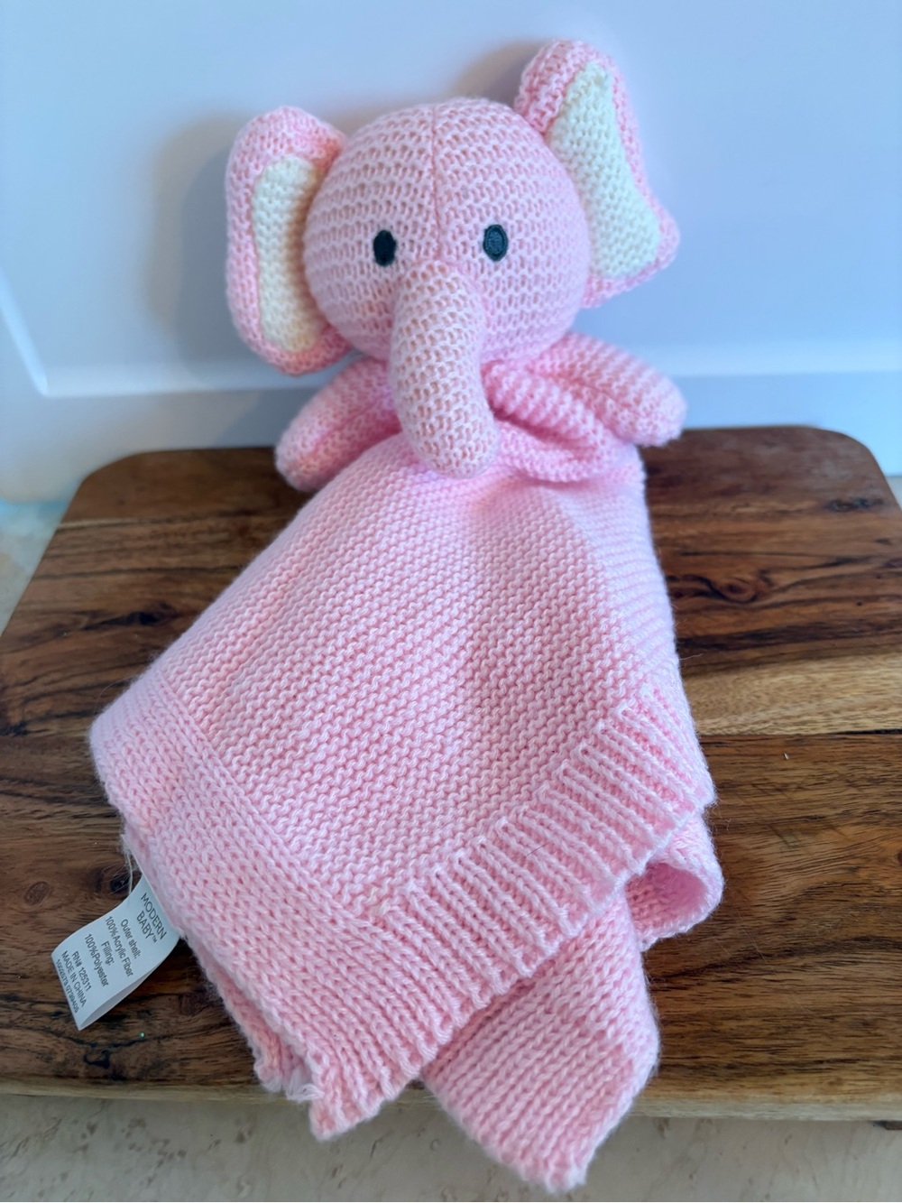 Modern Baby pink knit elephant security blanket featuring a plush elephant head